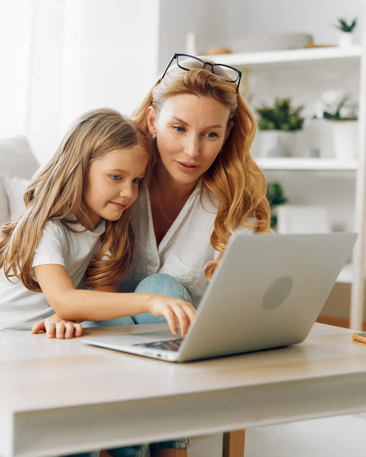 Mother and daughter researching IEP advocacy resources together on a laptop - Wynn Advocacy helps Nevada families navigate special education